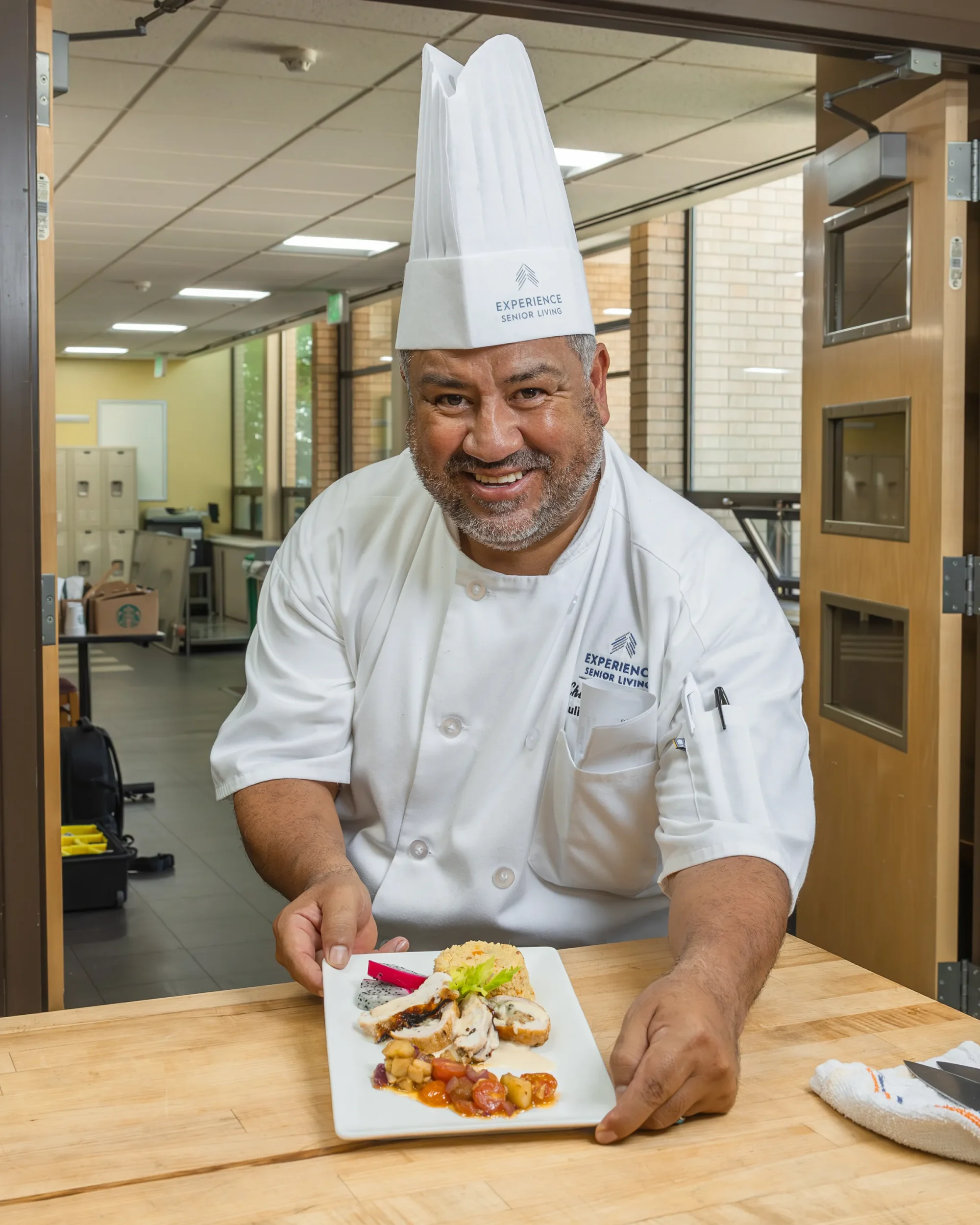 chef presenting plate of food