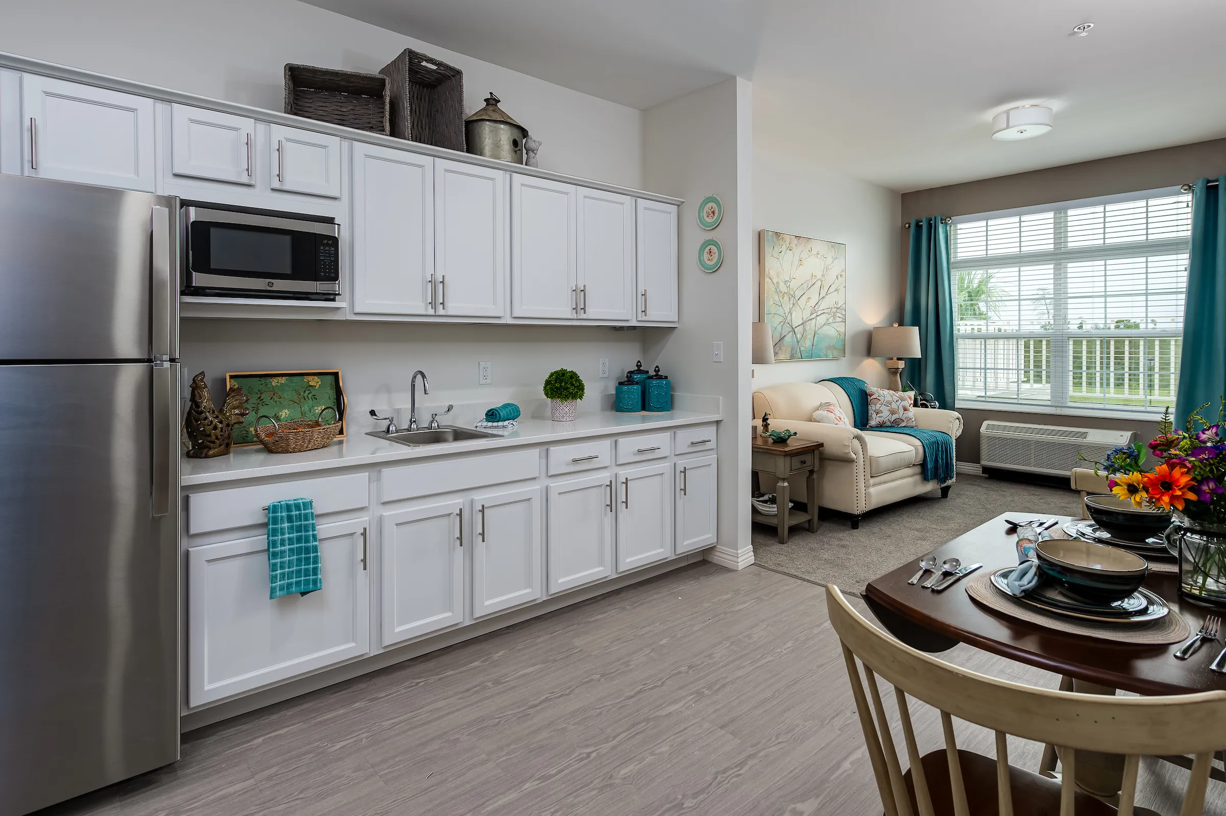 kitchen and living room in florida assisted living apartment