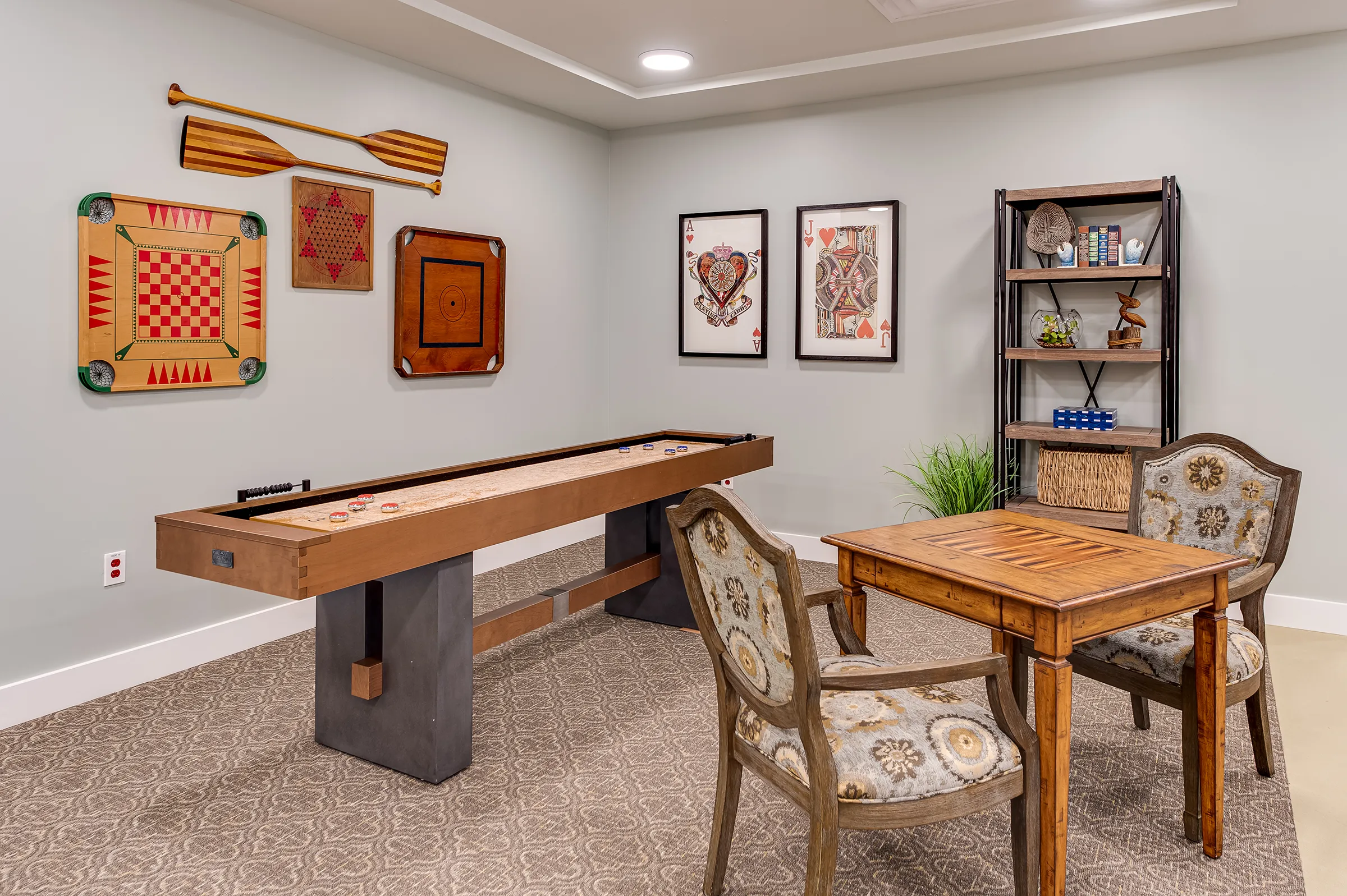game room with shuffleboard and chess table
