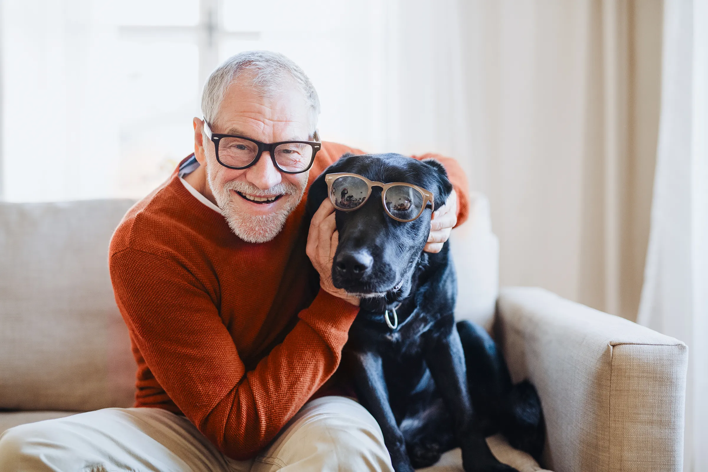 smiling man and dog with glasses