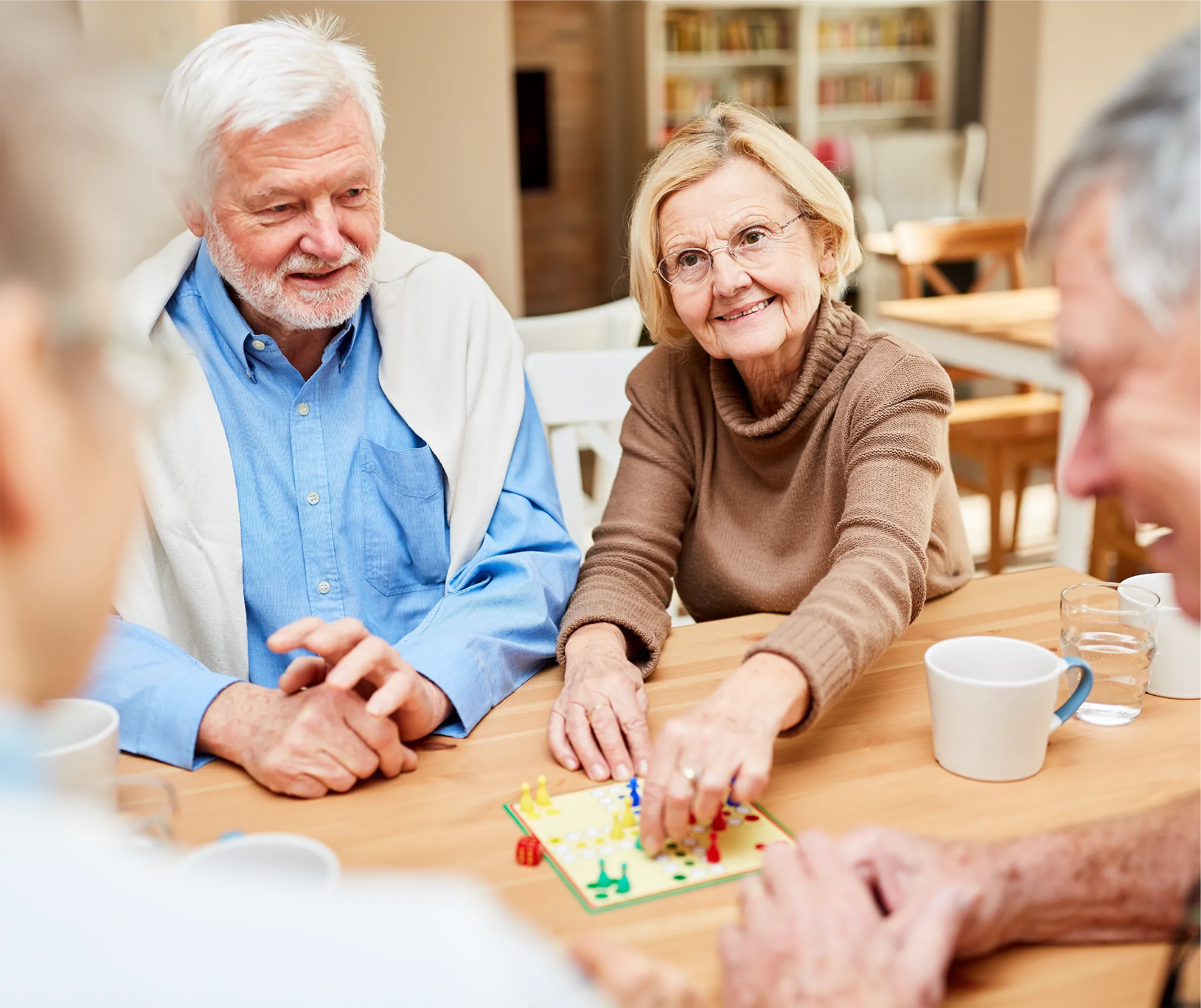 group playing board game at assisted living