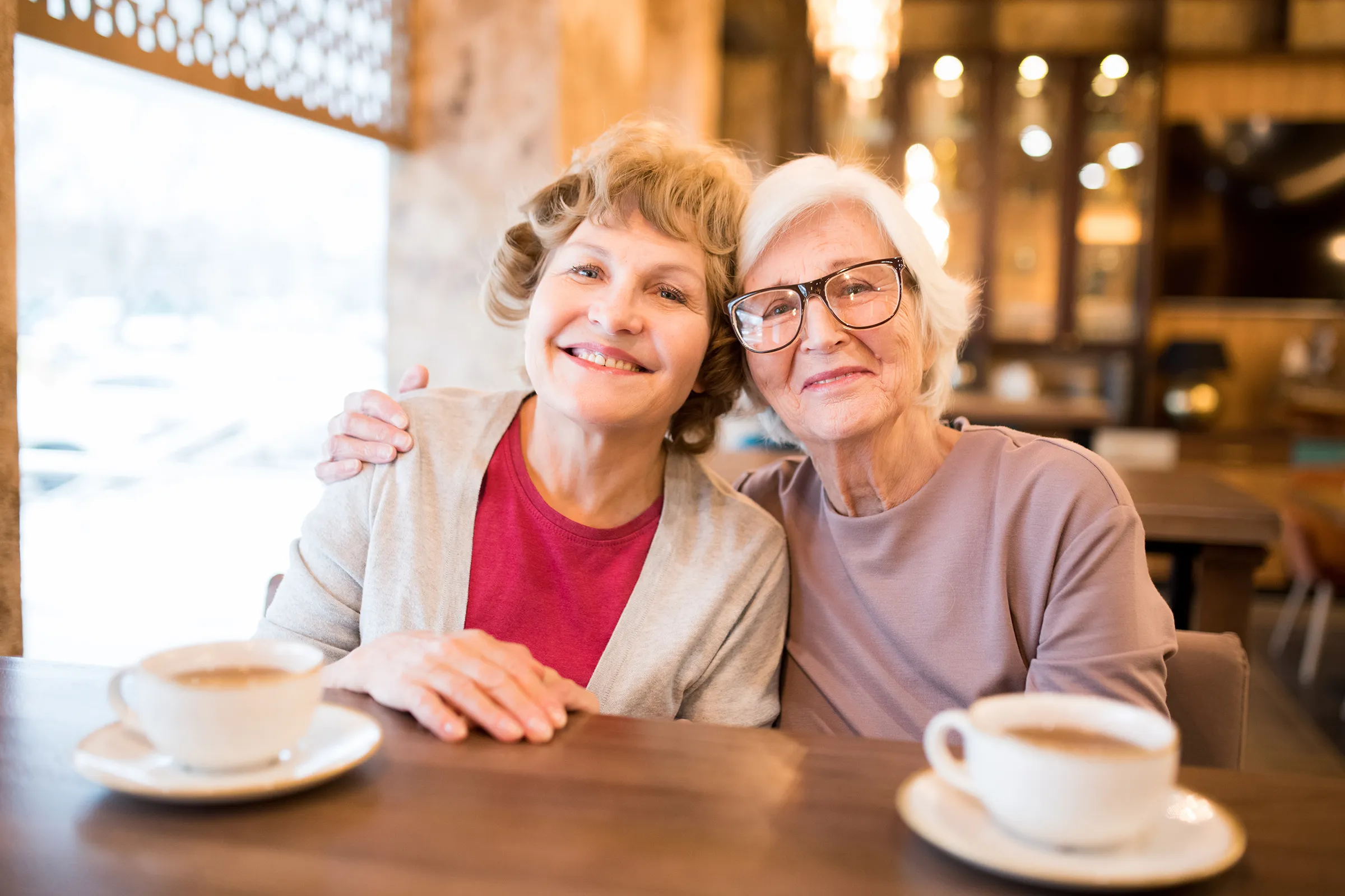 two happy senior women posing together