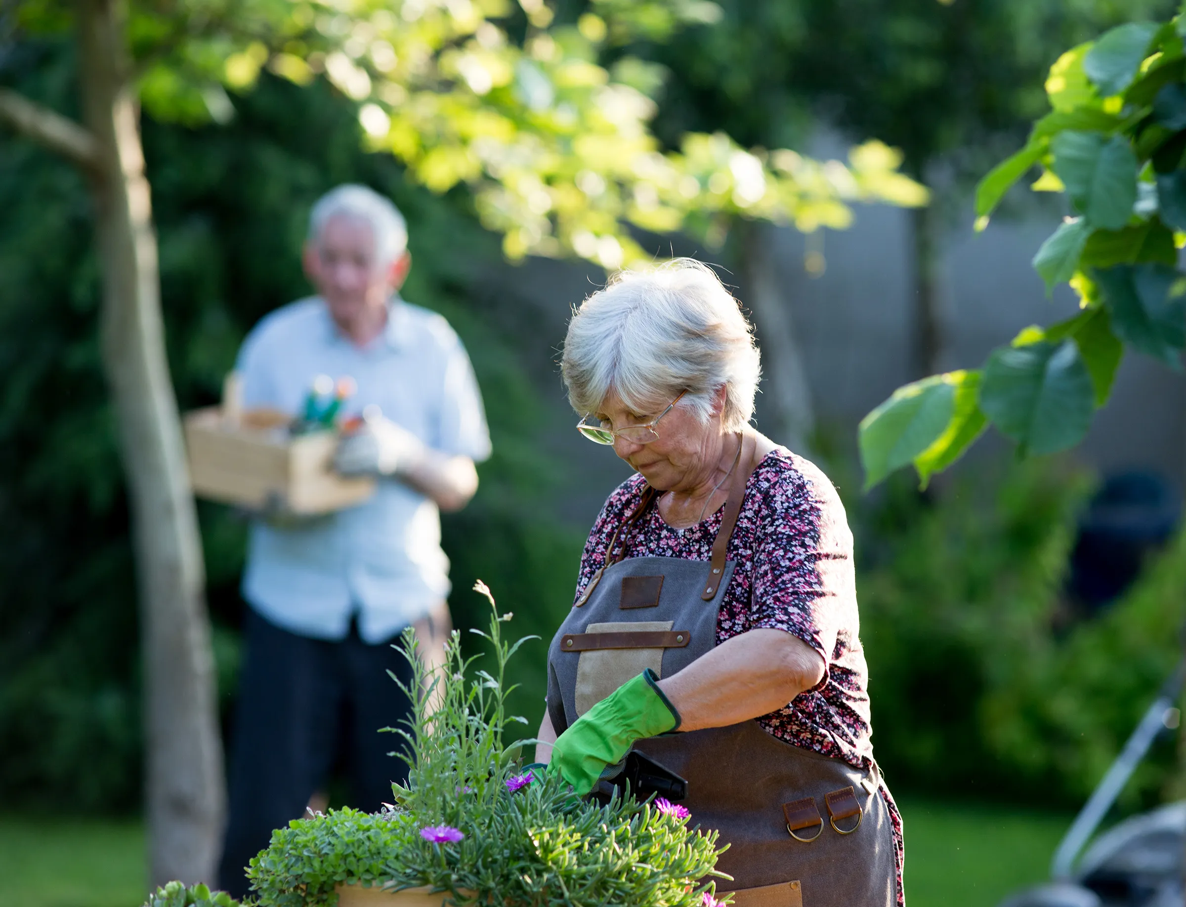 woman gardening in memory care garden